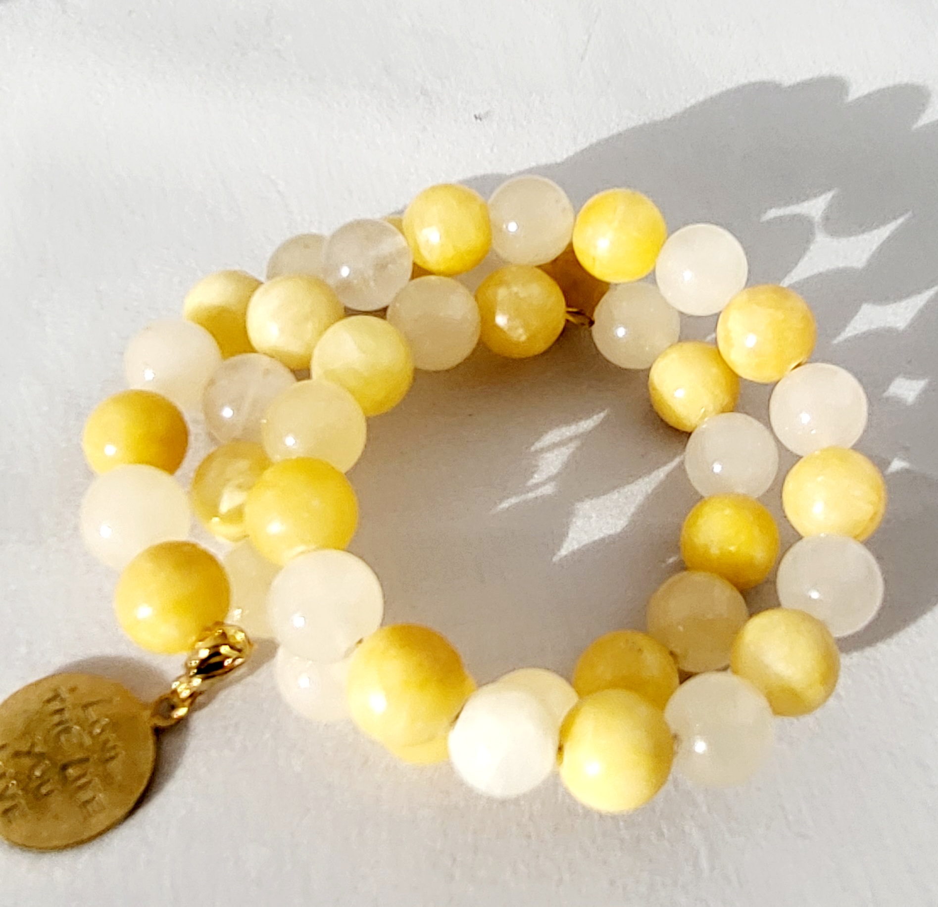 Armband van vergulde springdraad met citrine stenen + fournituur